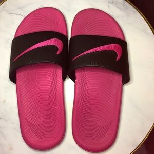 Hot pink Nike slides